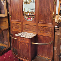 Attractive French Burr Walnut Hallstand. It has a single drawer, cupboard, brass rods, umbrella storage and a marble shelf. It is in good original condition. Please see photos as they form part of the description.