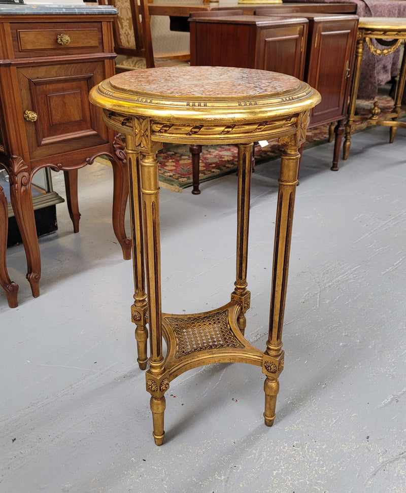 Late 19th Century French Louis XVI style round marble top side table/ lamp table. It is in good original detailed condition and has been sourced from France.