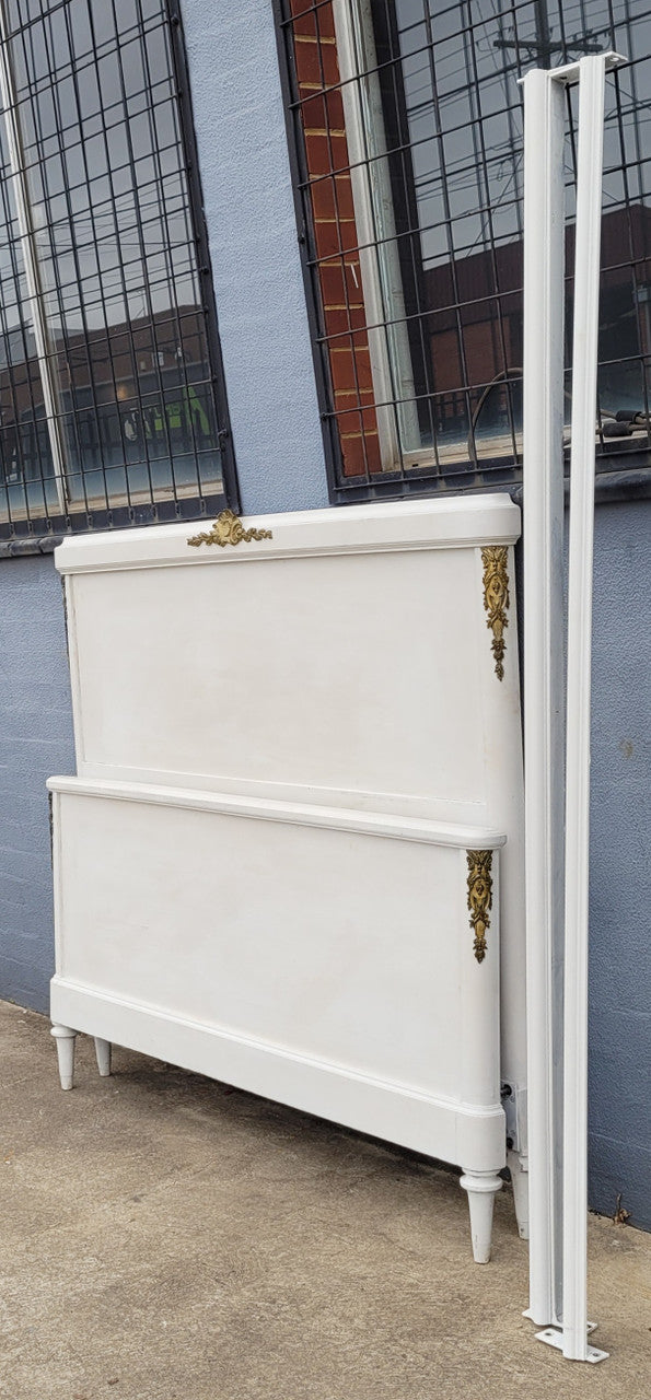 French Louis 16th style chalk painted queen size bed with gilt decorative mounts and includes custom slats. It has been sourced from France and in good original condition.