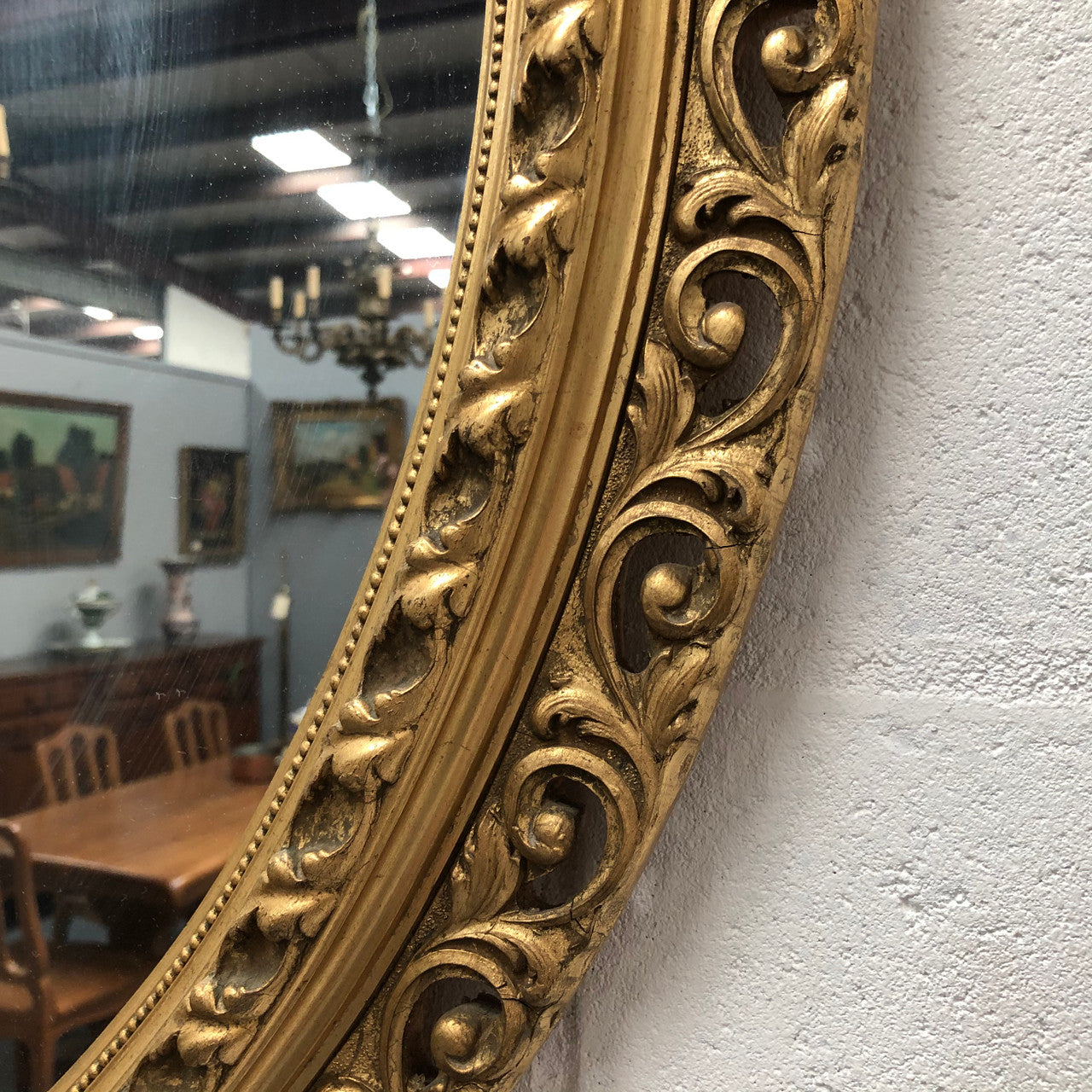 Decorative round gilt wall mirror.