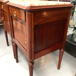 A lovely French inlaid pair of flame mahogany bedside cabinets with ormolu and in good condition.