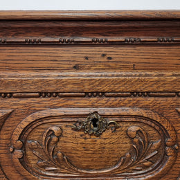 Early 19th Century French Oak chest of three drawers. It has beautiful handles and carvings. It is in good original detailed condition.