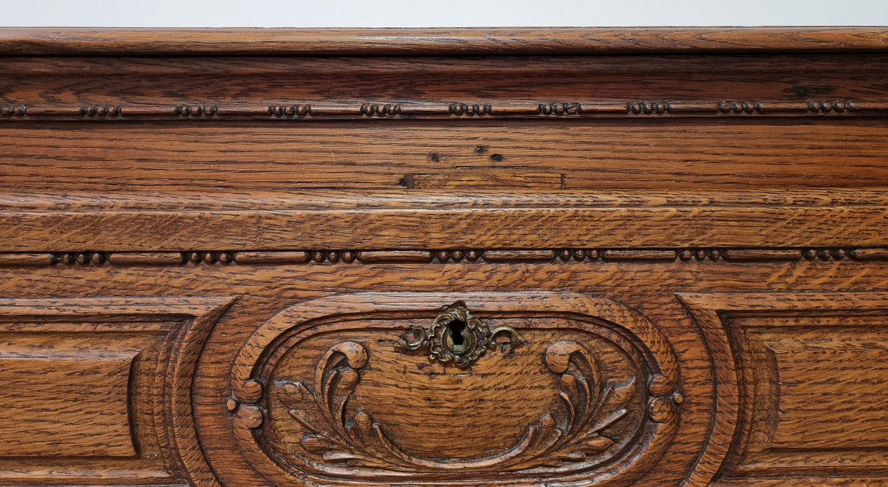 Early 19th Century French Oak chest of three drawers. It has beautiful handles and carvings. It is in good original detailed condition.