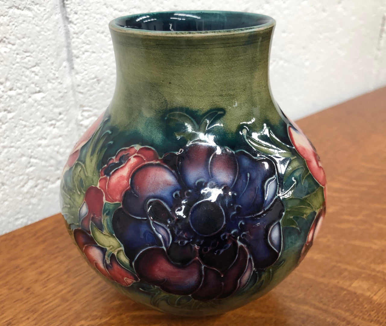 Anemone pattern hand-painted Moorcroft vase, in good condition.