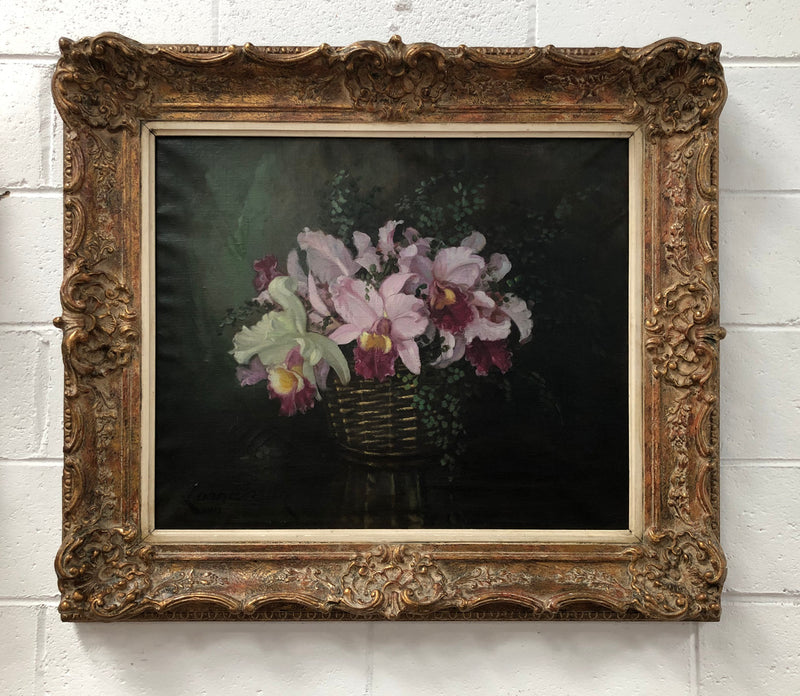 Signed French oil on canvas painting of "Orchids In Basket" In a beautiful ornate gilt frame. In good original detailed condition.