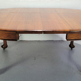Period blackwood two leaf extension table. It can comfortably sit six people and eight when extend. It is in good original detailed condition.