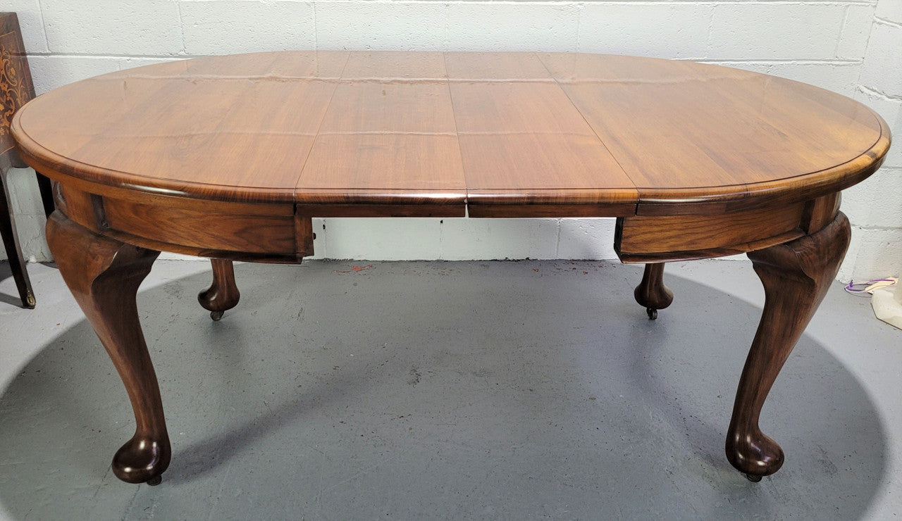 Period blackwood two leaf extension table. It can comfortably sit six people and eight when extend. It is in good original detailed condition.