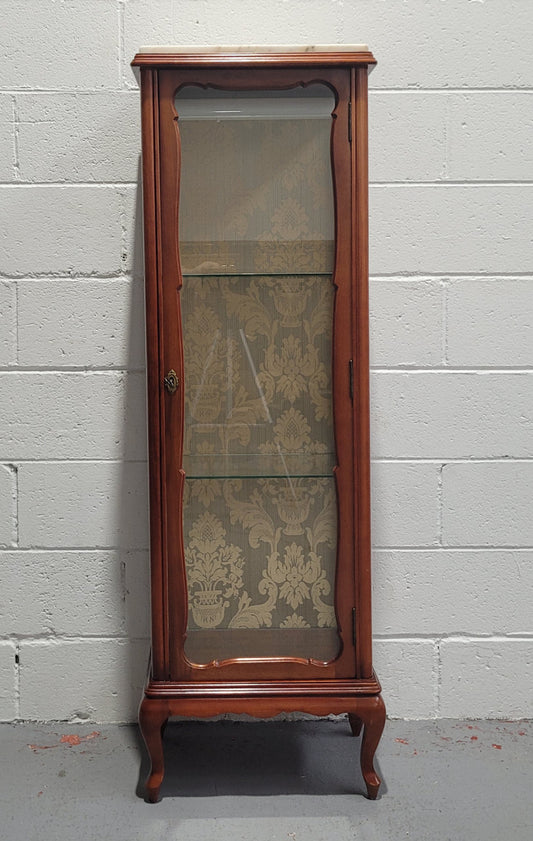 French Louis XV style small scaled display cabinet with marble top. It is of pleasing proportions with a lovely olive french damask fabric back and two glass shelves. In good original detailed condition.