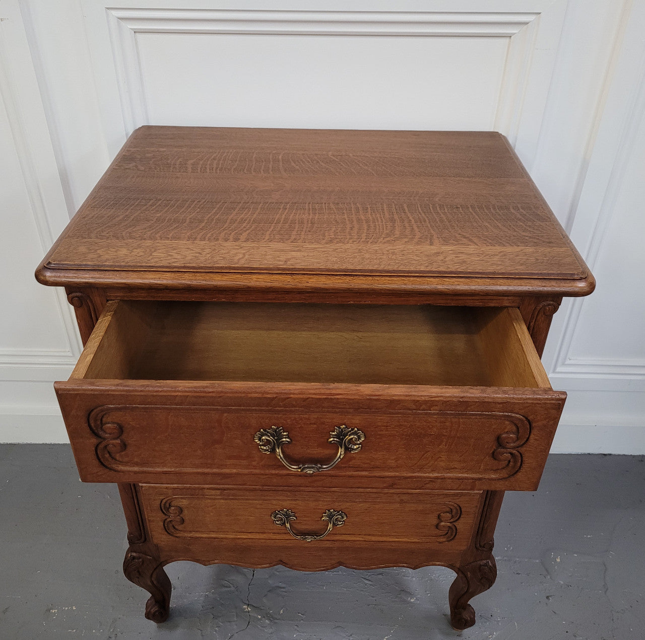 French Oak Louis XV style side drawers with lovely handles and three drawers. It has been sourced from France and is in good original detailed condition.