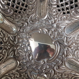 A Sheffield sterling silver bowl with repousse pattern, hallmarked WALKER & HALL and in good original condition.