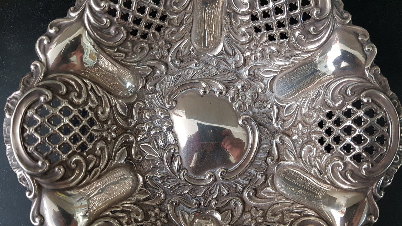 A Sheffield sterling silver bowl with repousse pattern, hallmarked WALKER & HALL and in good original condition.