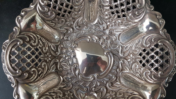 A Sheffield sterling silver bowl with repousse pattern, hallmarked WALKER & HALL and in good original condition.