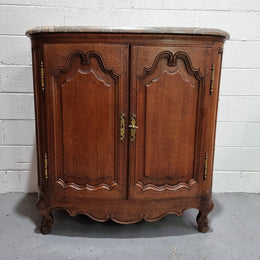 Rare 19th Century French Oak and marble top oval buffet / cabinet. Stunning thick marble top and decorative handles. In good original detailed condition.
