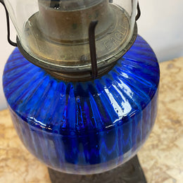 Victorian blue glass kero lamp with decorative metal base. Circa 1880's.
