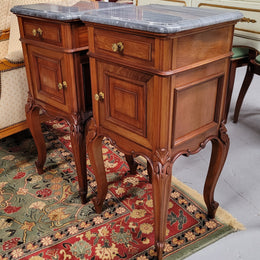 Pair of Walnut Louis XV style grey marble top bedside cabinets. Single drawer, one cupboard and lovely French cabriole legs. They have been sourced from France and are in good original condition.
