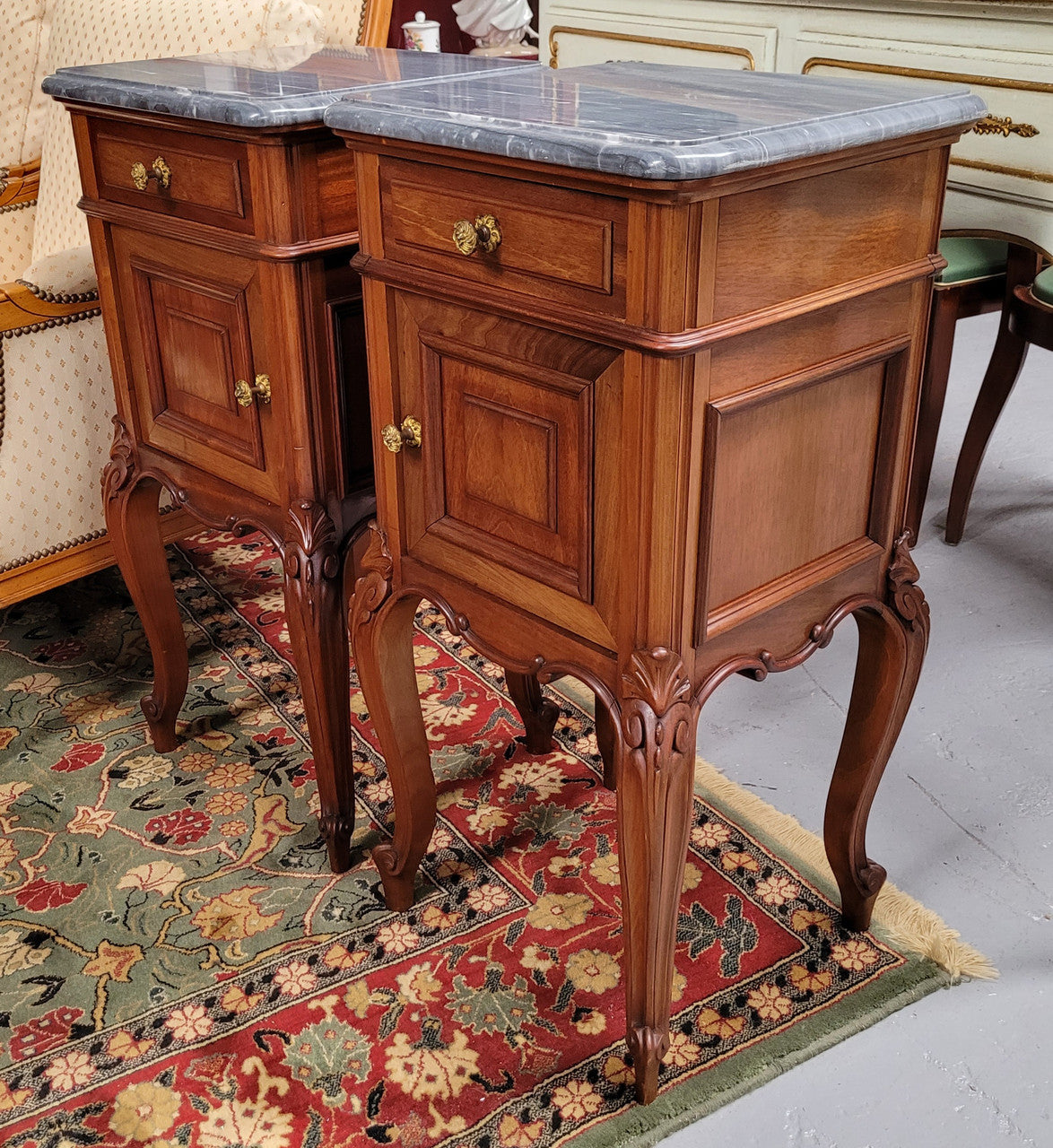 Pair of Walnut Louis XV style grey marble top bedside cabinets. Single drawer, one cupboard and lovely French cabriole legs. They have been sourced from France and are in good original condition.
