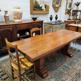 French Farmhouse table with a beautiful thick plank top and stretcher base. Can seat 8-10 people comfortably and is in good original detailed condition.