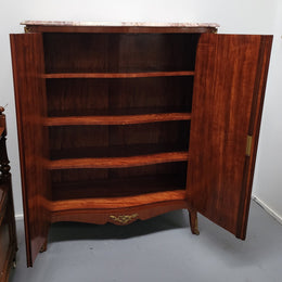 French Louis 15th style Kingwood marquetry inlaid two door cupboard with a beautiful marble top. It has three adjustable shelves and decorative ormolu trim. It has been sourced from France and is in good original detailed condition.