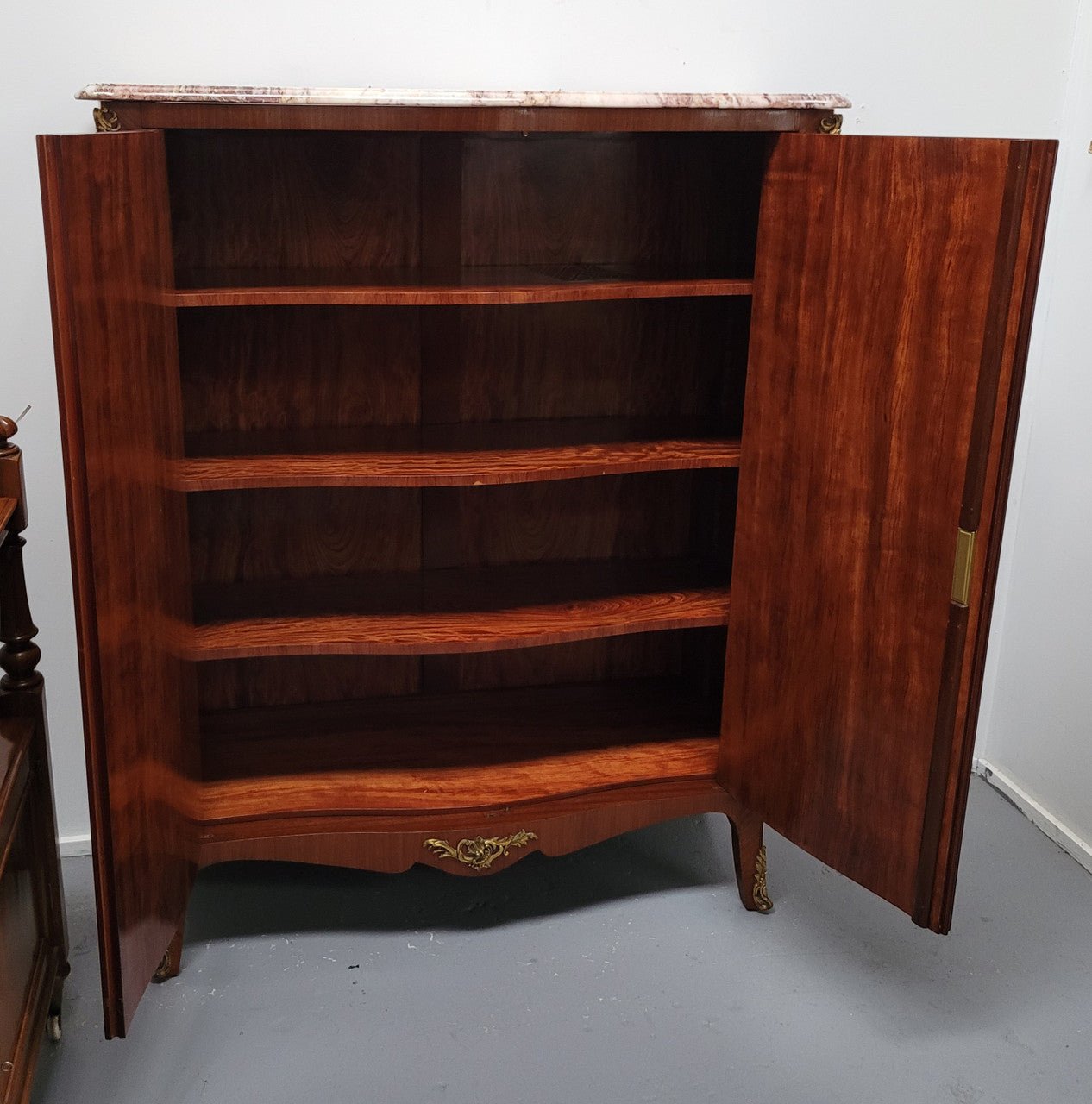 French Louis 15th style Kingwood marquetry inlaid two door cupboard with a beautiful marble top. It has three adjustable shelves and decorative ormolu trim. It has been sourced from France and is in good original detailed condition.