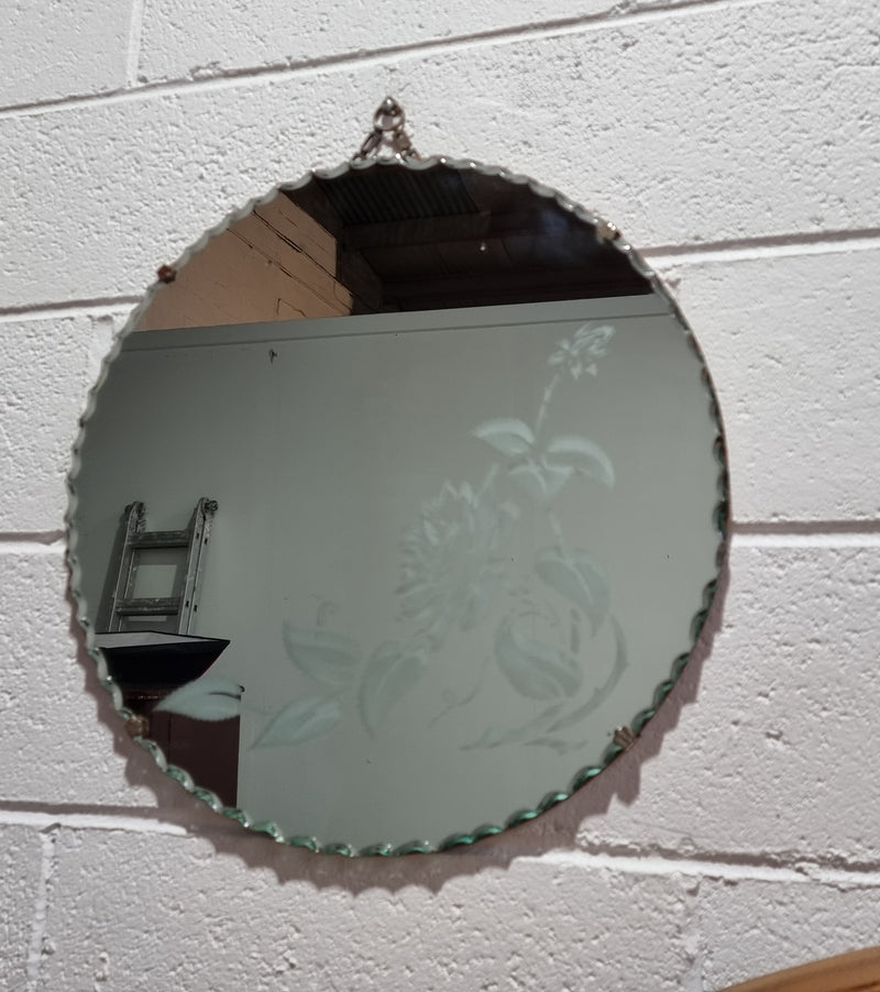 Vintage Art Deco round wall mirror with pie crust edge and etched floral design . In good condition, please see photos .