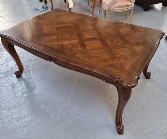 Fabulous large French style coffee table with a beautiful parquetry top. In good original condition.