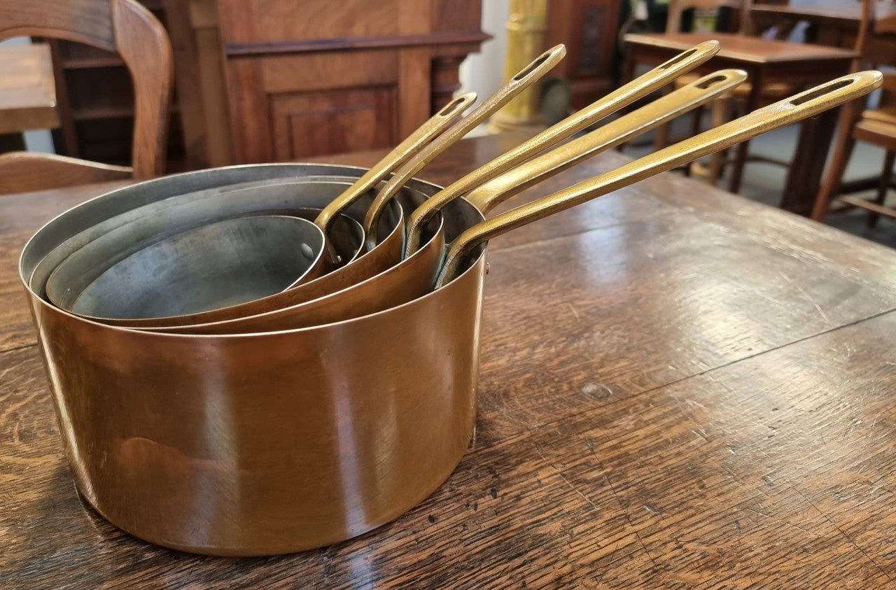 Set of Five French Vintage Copper & Brass Saucepans. They are in good original condition.