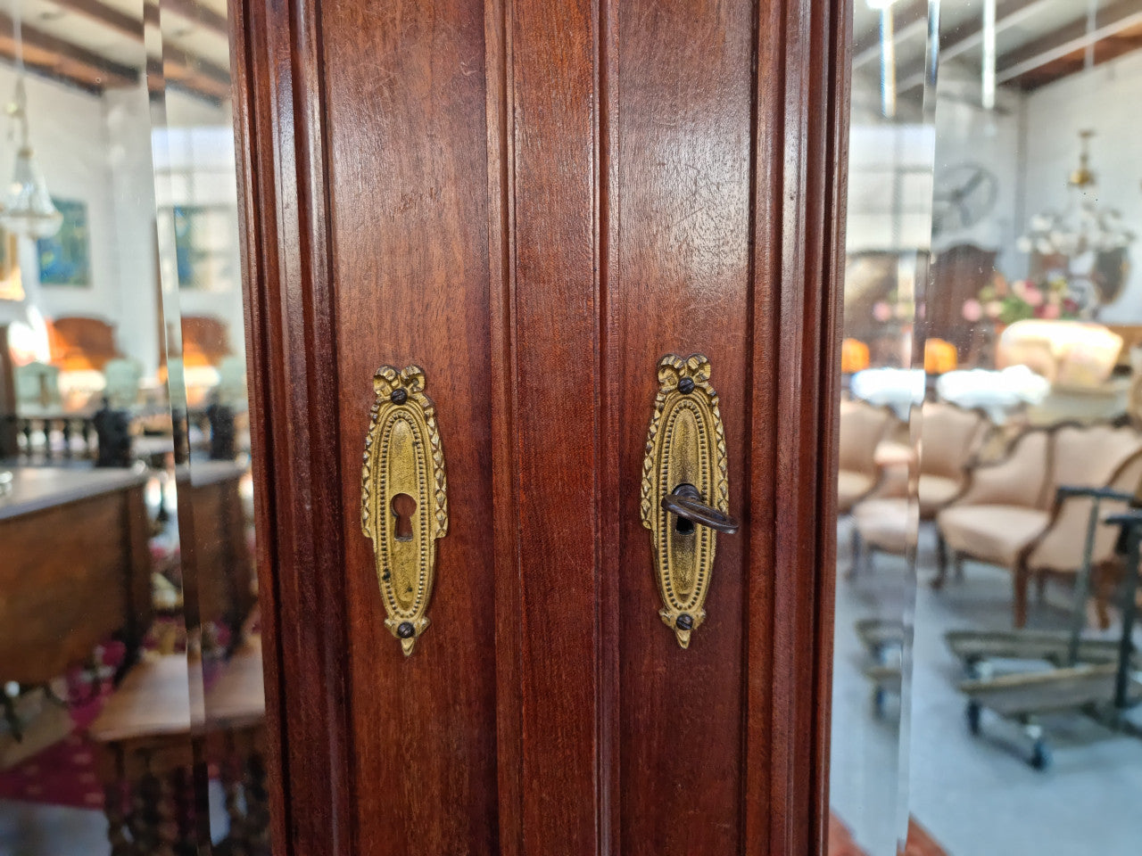 French Louis XVI style mirrored two door armoire/wardrobe. It has plenty of hanging space as well as two drawers at the bottom. In good original detailed condition.