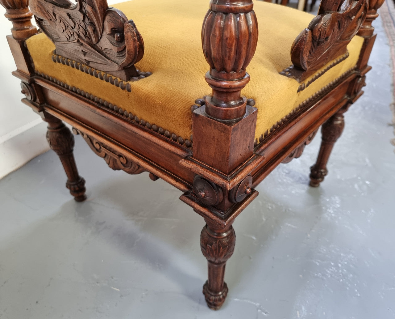 Beautifully carved French Walnut corner chair with upholstered seat. In good original detailed condition.