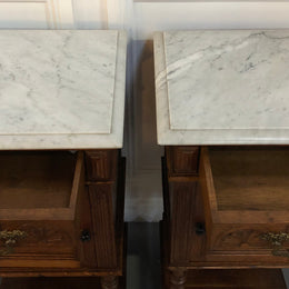 Pair of French Oak Arts and Crafts bedsides cabinets with lovely Carrara marble top and drawer and cupboard for storage. In good original detailed condition.