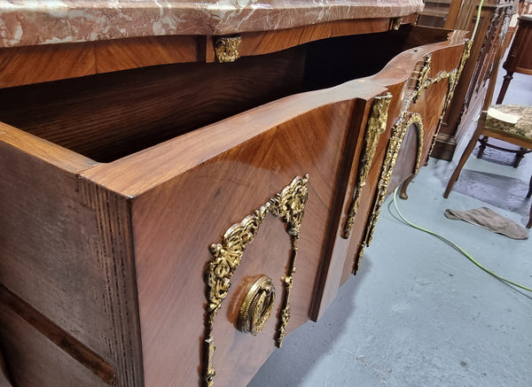 Stunning Louis XV style ormolu and marquetry marble top commode with two drawers. It has an amazing thick marble top and it is in good original detailed condition.