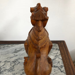 Chinese carved Teak Foo dog with very good detail. In good original condition.