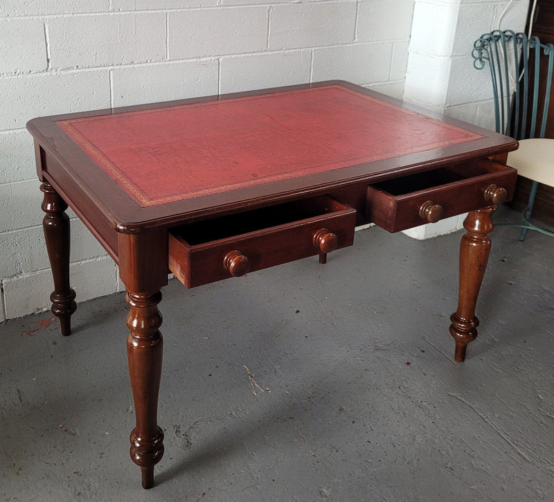 Victorian Cedar two drawer tooled leather topped desk with turned legs. In good original condition.