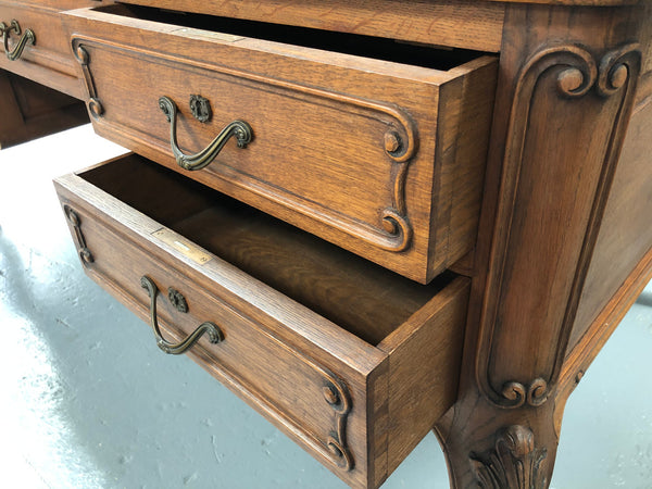 French Oak Louis XV style full partners desk with both sides having five functional drawers. In very good original detailed condition.