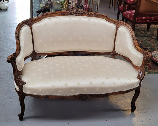Pretty French Louis XV style small Walnut settee with very good upholstery. Sourced from France and in good original condition, please view photos of the upholstery as it helps form part of the description.