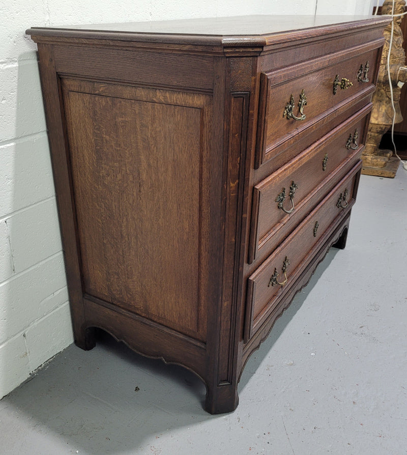 Solid Oak French 19th century three drawer commode, with decorative handles. In good original detailed condition.