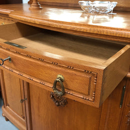 French Oak parquetry top sideboard with a glass top section for displaying and three cupboards and drawers for all your storage needs. Lovely carved details and is in good original detailed condition.