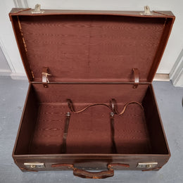 Impressive solid leather suitcase, moire fabric lined with leather straps to hold contents. Displays gold initials F.S.A near handle. With key. Please view photos as they help form part of the description.