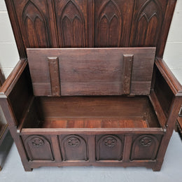 French Oak 19th Century gothic style high backed hall seat. Amazing detailed carving and is good detailed condition.