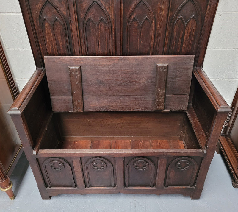 French Oak 19th Century gothic style high backed hall seat. Amazing detailed carving and is good detailed condition.
