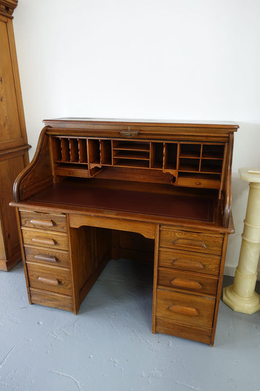An Antique American Oak Cutler Roll Top Desk