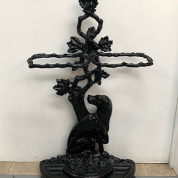 Black Cast Iron Umbrella Stand Displaying A Dog Under A Tree