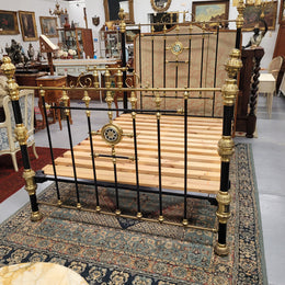 Rare Antique cast iron and brass Victorian queen size bed. Comes with custom made slats.  It has been sourced locally and is in good original condition.