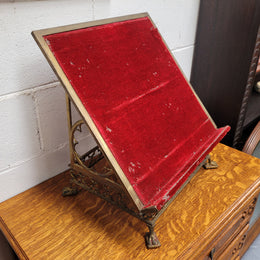 Antique French brass Gothic Revival book stand with red velvet. It has sourced from France and is in good original condition.