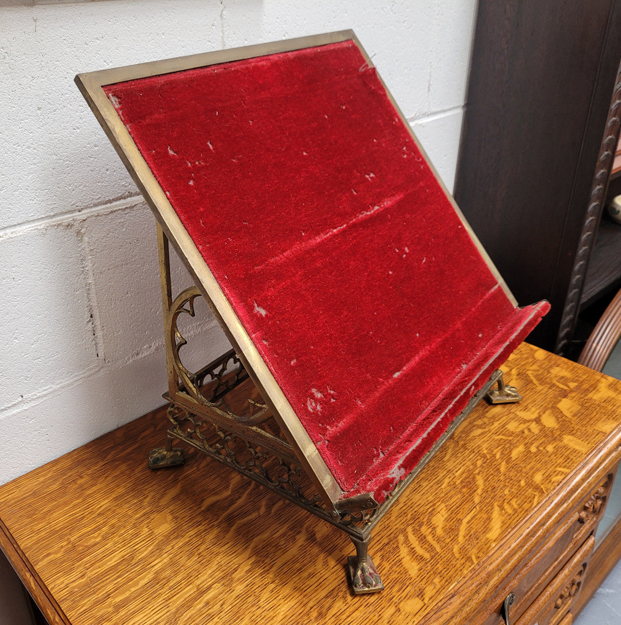 Antique French brass Gothic Revival book stand with red velvet. It has sourced from France and is in good original condition.