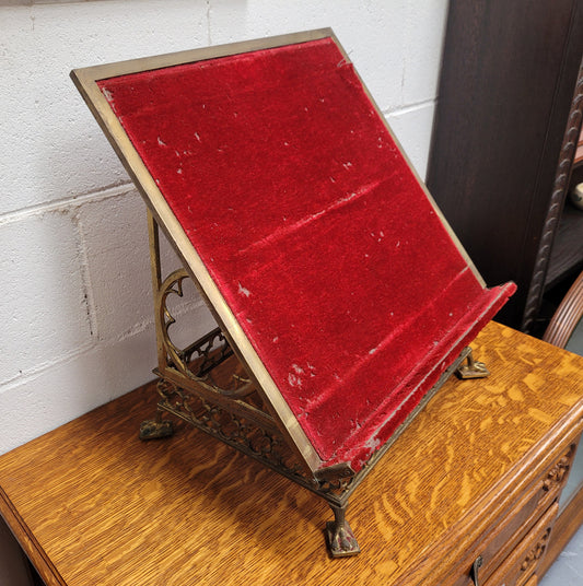 Antique French brass Gothic Revival book stand with red velvet. It has sourced from France and is in good original condition.