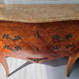 French marquetry inlaid Kingwood marble top commode. It has two drawers and beautiful mounts. Is in good original detailed condition.