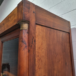Grand French Mahogany Empire two door bookcase. It has beautiful glass doors and has three fully adjustable shelves. It has been sourced from France and is in good original detailed condition.