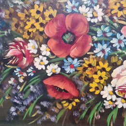 Sourced from France a stunning colorful floral oil painting on canvas. It is in a decorative gilt frame and is signed. It is in good original detailed condition.