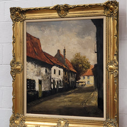 Dutch signed oil on canvas depicting village street in a beautiful gilt frame. It is in good original detailed condition and has been sourced from France.