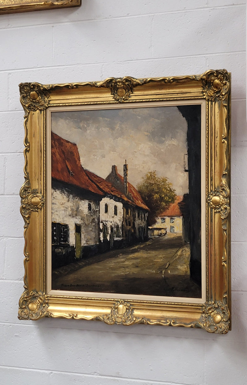 Dutch signed oil on canvas depicting village street in a beautiful gilt frame. It is in good original detailed condition and has been sourced from France.